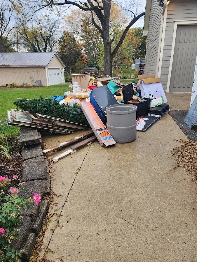 Dumpster being loaded with debris for 3 Yard Dumpster Rental in Hayward